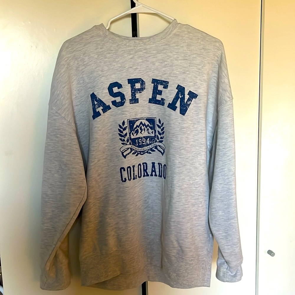 This is a grayish-whitish sweatshirt with navy blue lettering. 0 stains or rips.